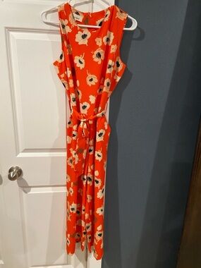 Orange Jumpsuit with Cream and Black Floral Accents